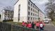 Red Cross members stand in a circle outside the Germersheim barracks